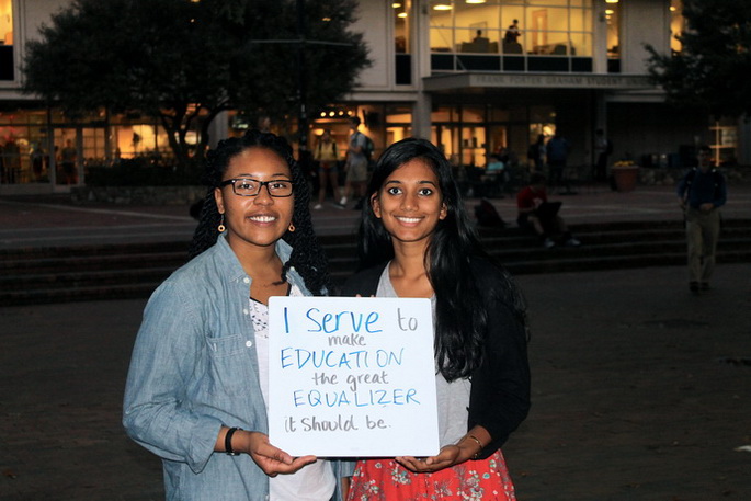 Rani Reddy and Tasia Harris Holding Why I Serve Sign
